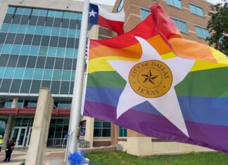 Annual elevating of the Satisfaction flag in Dallas