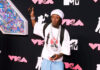 Lil Uzi Vert Debuts New Hairstyle & Brings Out Stacks Of Cash On Stage