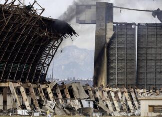 Demolition of burned Tustin hangar underway; asbestos ranges low