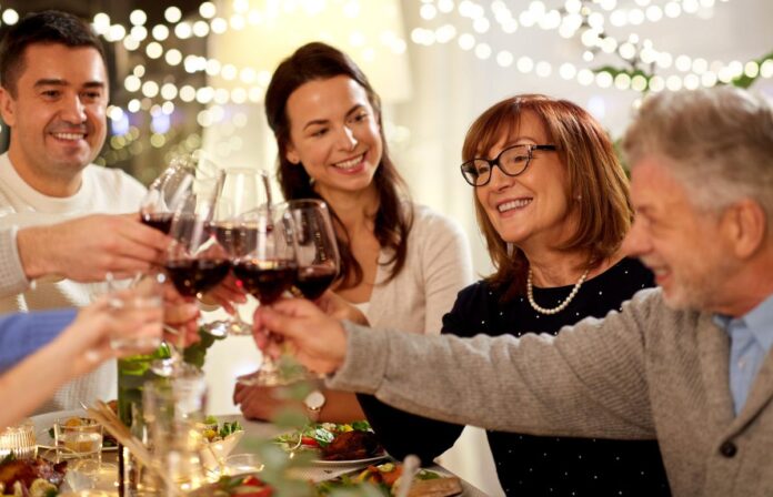 happy-family-dinner-party-drinking-142060287.jpg
